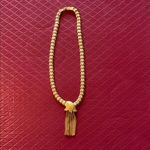 Gold necklace with tassel